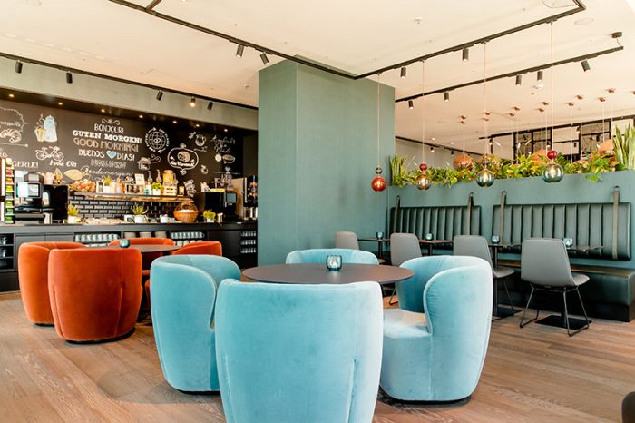 Bar and lounge area at the Motel One hotel at Nuremberg Central Station with modern seating for relaxation.