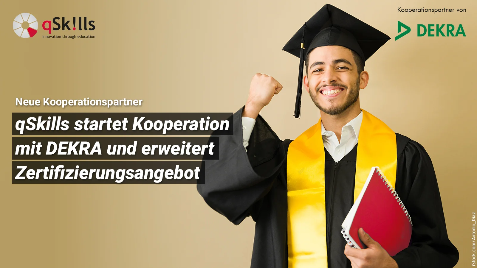Cooperation with DEKRA - Happy graduate celebrates with graduation gown and notebook